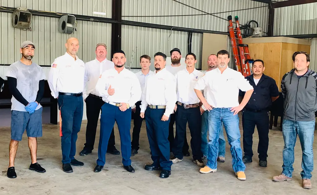 The David's Same Day Services team photographed together in their Conroe shop